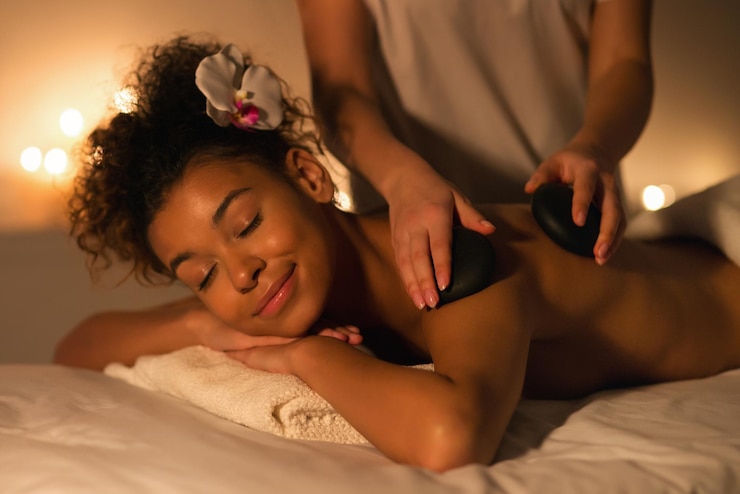 relaxing-hot-stone-massage-therapy-session-black-lady_116547-108813